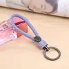 Novo Chaveiro de Corda de Couro de Aço de Tungstênio Tecido à Mão Presente Criativo Pingente Universal para Carro Chaveiro Gravado Venda por Atacado