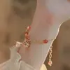 2026 Nuevo Modelo Ins Xiaohongshu Diseño de Nicho Pulsera de Amistad con Colgante de Campana Dorada Estilo Chino para Mujeres