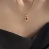 Collar con colgante de circonita roja de Año Nuevo para mujer, ideal para otoño e invierno, con cadena para suéter que combina con todo y cadena para clavícula.