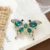 Moda Europea y Americana Broche de Mariposa Esmeralda Incrustado de Diamantes Accesorios para Ropa Aleación Galvanizada Accesorios de Joyería Anti-Exposición Broche