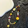 Colgante Original Hecho a Mano Amarillo para Perro de Rugby para Teléfono Cadena Linda para Teléfono con Cuentas Cordón Ccd Colgante para Cámara Moderno