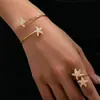 Set de 2 Piezas Estilo Europeo y Americano Estrella de Mar Dorada Vacaciones en la Playa Pulsera y Anillo Versátiles de Personalidad con un Toque de Lujo
