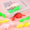 Catapulta dinosaurio tirachinas de dedo creativo descompresión truco divertido lanzamiento dinosaurio pegamento suave juguetes extraños venta al por mayor