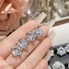 Suministro en vivo de camelia venta caliente aretes de botón de diamante de imitación chapados en oro de 18 quilates aretes brillantes de diosa de flor rosa