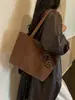 Bolsa de mano minimalista transfronteriza, nuevo estilo 2026, gran capacidad, bolso de hombro moderno, texturizado, casual y adecuado para el trabajo, se puede llevar debajo del brazo