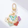 Llavero Minimalista Femenino Flor de Peral Floral Japonés Mariposa Colgante Accesorio de Aleación Tendencia Estilo Coreano para Mochila