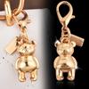 Colgante para llave de coche, bolso de gran sentido, accesorios de color dorado, oso, cereza, trébol de cuatro hojas, mariposa, bolso escolar, joyería al por mayor
