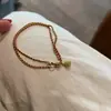 Popular Pulsera de Cuerda Trenzada Roja de Doble Hilo con Pequeño Colgante de Despertar del León de Xiaohongshu Diseño Otoño e Invierno Navidad Joyería de Mano Envío Directo