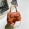 Bolso de moño elegante de alta calidad para mujer, bolso cruzado versátil de nueva moda, bolso cuadrado pequeño de color liso para llevar en la mano para salir