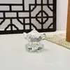 Nuevo modelo de tetera giratoria de vidrio con mango de cristal Rotación flexible de 360 grados Decoración de la fortuna para Oficina, Sala de Estar y Coche