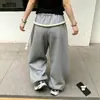 Diseño europeo y americano con costuras de cuerda gruesa, estilo callejero deportivo americano, pantalones de chándal de pierna ancha curvados holgados de invierno engrosados