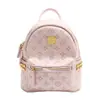 Entrega en una sola pieza popular mochila rosa de gran capacidad 2024 moda de alta calidad remache mochila pequeña venta al por mayor
