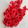 Flor roja de simulación diseño de auditorio de bodas paisajismo pared de fondo de flores artificiales decoración techo de flores camino de flores guía arreglo floral flor