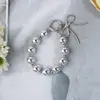Luxo Leve Estilo Coreano Liga de Resina Pérola Corrente Pendurada Corrente de Celular Chaveiro de Carro Decoração de Bolsa Pulseira de Pulso Moderno e Versátil