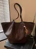 Bolsa de mano grande transfronteriza para mujer, nueva moda otoño 2026, bolso de hombro, elegante y versátil para el trabajo y los desplazamientos