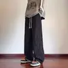 Pantalones casuales de moda retro de calle estilo americano con una variedad de elementos de diseño, corte holgado, tejido, pierna recta, lavado y favorecedores para la figura