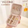 Caja de joyería caja de almacenamiento portátil aretes de botón Joyería collar anillo pequeño exquisito mini nuevo transfronterizo