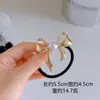 Banda de goma elástica alta para el cabello, aro de moda de lujo con lazo de perla, cuerda de cabeza redonda para mujer, cuerda de pelo de cola de caballo alta de aleación, nuevo estilo