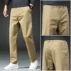 Pantalones casuales de color liso engrosados con forro polar de otoño e invierno para hombre, sueltos, rectos, de negocios modernos de invierno, pantalones de traje para jóvenes