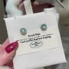 Venta al por mayor de fábrica suministro en vivo material natural peligroso aretes de jadeíta agua azul plata s925 incrustada diseño pequeño y fresco mujer