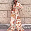 Ropa Femenina Transfronteriza Europea y Americana 2026 Elegante Moda Vestido de Cuello en V Mangas Largas Acampanadas Cintura Alta Suelto Falda Larga Estampada