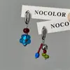 Enviar-lhe um pequeno brinco de flor azul assimétrico com design de nicho brincos finos de alta qualidade brincos Joker