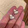 Pendientes para hombre con forma de estrella de amor cepillada esmerilada 2025 nuevo popular de lujo ligero alta gama pendientes con clip para oreja femenino nicho único