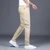 Pantalones Casuales Gris Claro Primavera 2026 Hong Kong para Hombre Ajuste Delgado Elásticos Ajustados Pantalones de Vestir de Gama Alta