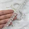 El fabricante vende cintas hechas a mano con cuentas, encaje tejido con cuentas y accesorios para prendas de vestir para vestidos cheongsam.