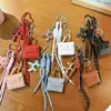Serie Miu Transfronteriza Bolso Cuadrado Pequeño de Piel Regalo Creativo Billetera para Monedas Llavero Bolsa para Auriculares Colgante Llavero