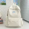 Mochila de gran capacidad para estudiantes de secundaria y preparatoria, estilo nuevo, bolsa escolar con moño, alta apariencia, mochila de viaje