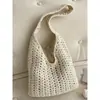 Bolsa tejida de gran capacidad transfronteriza para mujer, nuevo bolso de hombro versátil casual calado 2026, bolsa de playa estilo vacación costera