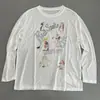 Camiseta Branca Casual Fina Solta Versátil Redutora de Idade para Mulheres, Estilo Novo Primavera e Verão com Estampa de Cobra Desenho Animado e Detalhes de Diamante, Manga Longa