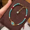 Pulsera elástica popular estilo étnico turquesa de Xiaohongshu, nuevo estilo chino, método antiguo, diseño que ilumina la piel, joyería de cuentas, venta al por mayor de una sola pieza