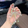 Chaveiro de Carro de Cristal Multifacetado em Forma de Laço de Luxo, Pingente de Celular com Contas Estilo Ins, Acessório de Bolsa Moderno e Único