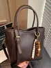 Bolso tipo bandolera cubo de aspecto elegante para mujer 2025 Invierno Nuevo Bolso de mano casual Popular Bolso de hombro Bolso cruzado retro