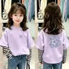 Camiseta de manga larga de algodón puro para niña, nuevo estilo primavera/otoño 2026, diseño de dibujos animados, aspecto en capas, top base moderno para niñas pequeñas