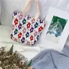 912132 Corea ins pequeño fresco lindo bolsa pequeña de tela mujer arrugada bolso estampado bolsa de almuerzo venta al por mayor