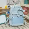 Brisa fresca, suave niebla, mochila con lazo de color azul sal marina de baja saturación para estudiantes de primaria, ligera y cómoda para ir a la escuela