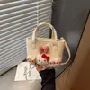 Bolso Cubo de Nicho Nuevo de Verano 2026 Transfronterizo para Mujer, Bolso de Hombro Cruzado Simple y Elegante, Bolso de Mano Versátil para el Trabajo