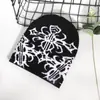 Al por mayor personalizado transfronterizo de tendencia en stock sombrero de punto jacquard caliente otoño e invierno cálido moda hip hop casual sombrero para el frío