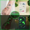 Pegatinas de Tatuaje de Dibujos Animados para Niños, Mundo de Dinosaurios Luminoso, Pegatinas Temporales Impermeables para Cara de Niños y Niñas, Stock Listo Transfronterizo