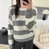 Suéter casual a rayas hueco de cuello redondo y manga larga para mujer, nuevo modelo otoño e invierno 2026, tejido base holgado y versátil