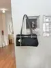 Bolso de lona de alta gama de nicho 2026 nuevo estilo moderno versátil bolso de hombro único de lona bolso tote de hombro único bolsa para ir al trabajo