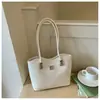 Bolso de hombro con lazo estilo coreano 2026 transfronterizo para mujer, bolso de axila de nicho, bolso tipo cubo moderno y simple para el trabajo diario para mujer