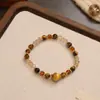 Pulsera de Piedra Ojo de Tigre Natural Color Tierra Maillard Pulsera de Otoño e Invierno Elástica Lujo Ligero Nicho Versátil Joyería para Mano Venta al por Mayor
