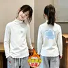 Camiseta de Manga Larga para Niña Otoño/Invierno 2026 Nuevo Estilo Niña Pequeña Térmica Polar Cepillado Capa Interior Volantes Casual Camiseta Base
