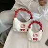 Bolso de mano de gato dulce y lindo estilo coreano, un bolso cruzado mini y único para madres e hijas, con un diseño plisado y una sensación moderna, ligera y lujosa.