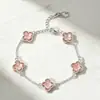 Pulsera de flor de cuatro pétalos de cristal para comercio exterior transfronterizo, versión coreana, lujo ligero, diseño de alta gama, accesorio de mano floral estilo Ins