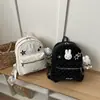 Mochila de peluche de conejo linda estilo caricatura coreana con lunares y colores contrastantes, gran capacidad, adecuada para estudiantes y diseñada para atraer a las niñas jóvenes